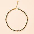 Collier NAMAKA Or turquoise sur fond clair